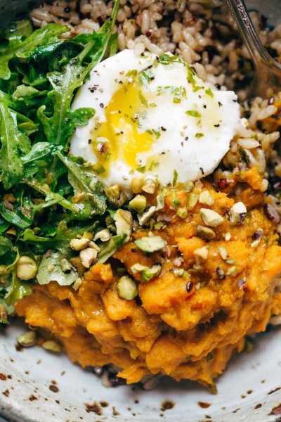 Healing Bowls with Turmeric Sweet Potatoes, Poached Eggs, and Lemon Dressing